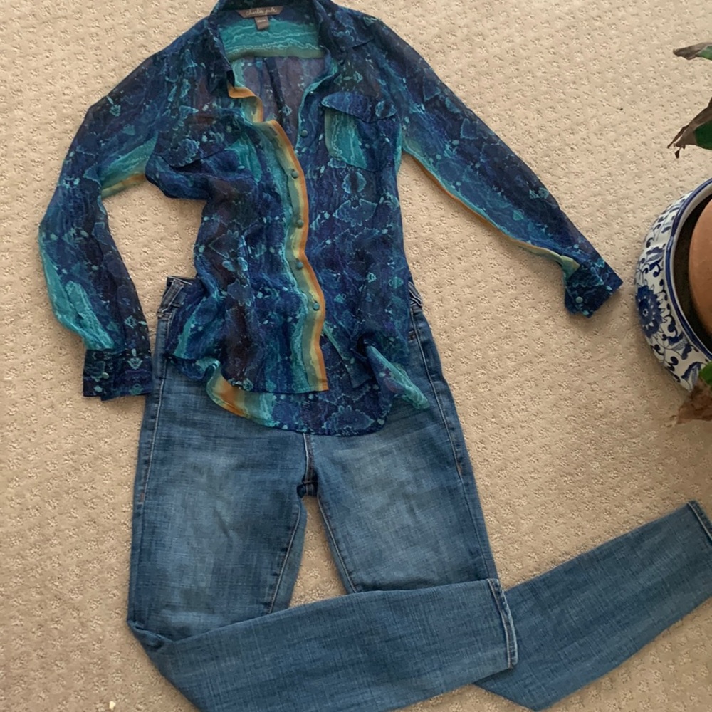 Charlie Jade navy multi silk top. Subtle rainbow and animal print background.